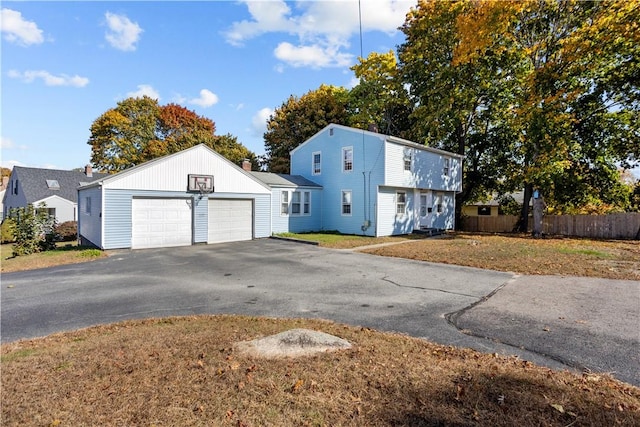 211 Tiogue Ave, Coventry, RI 02816 - colonial house with driveway and a garage