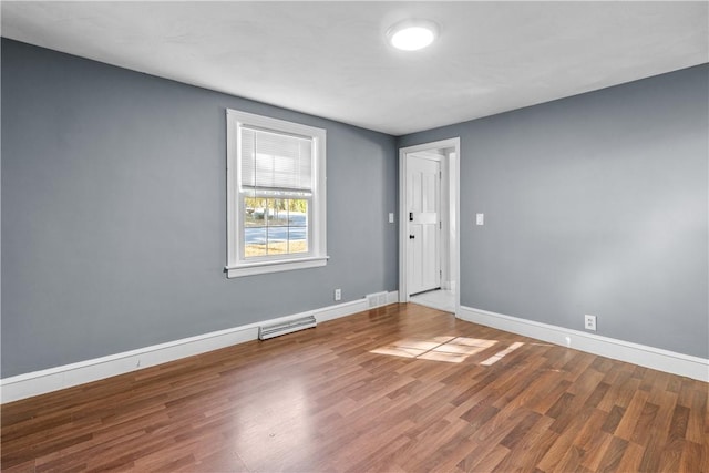 211 Tiogue Ave, Coventry, RI 02816 - unfurnished room with baseboards and wood finished floors