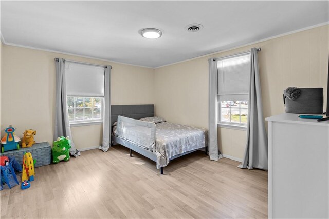 211 Tiogue Ave, Coventry, RI 02816 - bedroom featuring light wood-style flooring, multiple windows, and crown molding