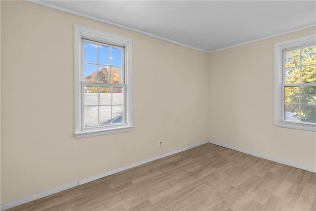 211 Tiogue Ave, Coventry, RI 02816 - spare room with light wood-style floors and ornamental molding