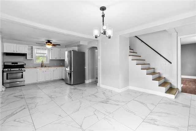 211 Tiogue Ave, Coventry, RI 02816 - kitchen with appliances with stainless steel finishes, light countertops, range hood, and white cabinets