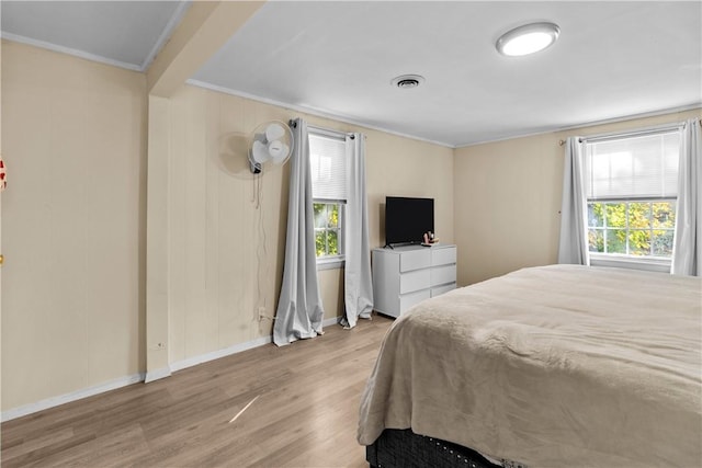 211 Tiogue Ave, Coventry, RI 02816 - bedroom featuring crown molding, wood finished floors, and multiple windows