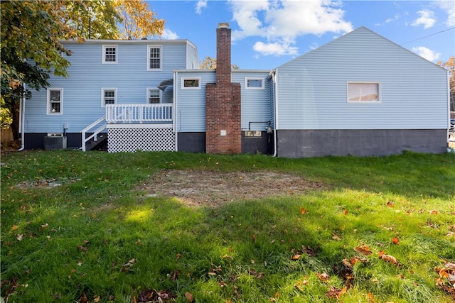 211 Tiogue Ave, Coventry, RI 02816 - rear view of property featuring a deck, a chimney, and a yard