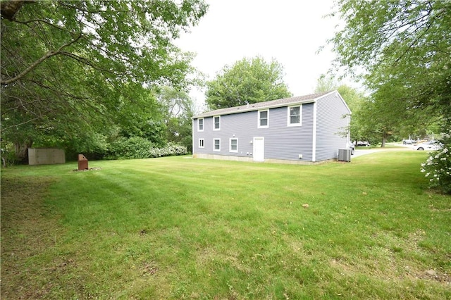 92 Trout Dr, Middletown, RI 02842 - back of house featuring a lawn and a storage shed