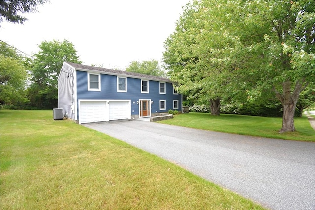 92 Trout Dr, Middletown, RI 02842 - colonial home featuring driveway, a garage, and a front lawn