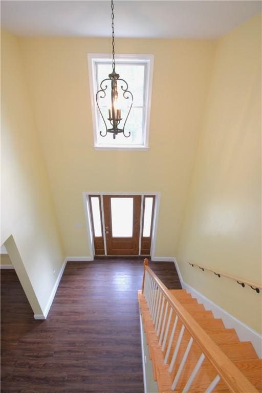 92 Trout Dr, Middletown, RI 02842 - foyer with a chandelier, dark wood finished floors, a towering ceiling, and stairway