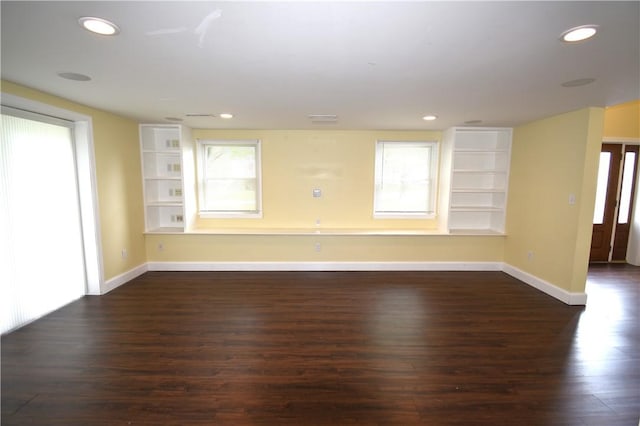 92 Trout Dr, Middletown, RI 02842 - unfurnished living room with dark wood finished floors, recessed lighting, and built in shelves