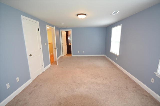 92 Trout Dr, Middletown, RI 02842 - unfurnished bedroom with light carpet and baseboards
