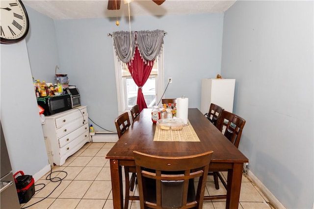 467 Plainfield St, Providence, RI 02909 - dining space with light tile patterned floors, ceiling fan, and a baseboard radiator