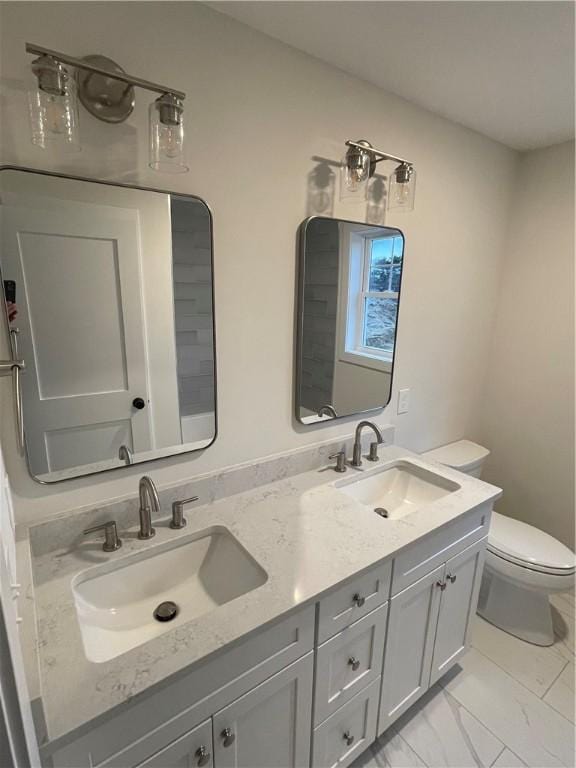 59 Recess Ln, Warwick, RI 02889 - bathroom featuring double vanity and marble finish flooring