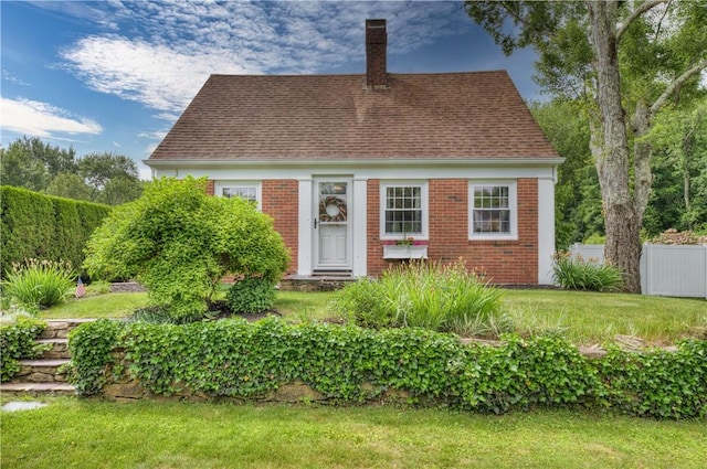426 Buxton St, North Smithfield, RI 02896 - view of front of house featuring brick siding, a chimney, and a shingled roof