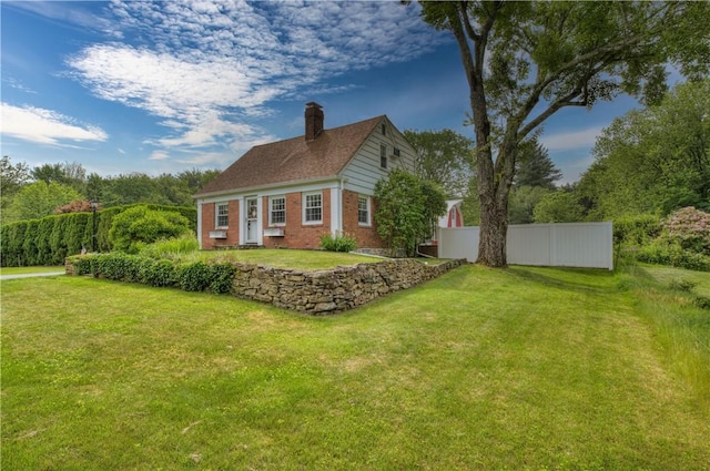 426 Buxton St, North Smithfield, RI 02896 - view of home's exterior featuring brick siding and a chimney