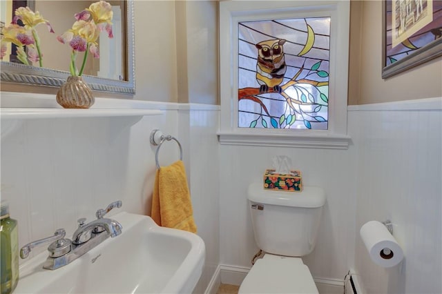426 Buxton St, North Smithfield, RI 02896 - half bath featuring wainscoting and a decorative wall