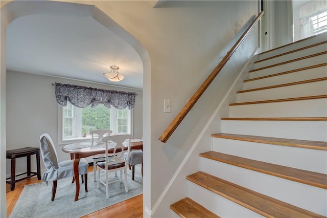 426 Buxton St, North Smithfield, RI 02896 - stairs featuring arched walkways, healthy amount of natural light, and wood finished floors