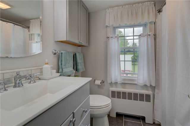426 Buxton St, North Smithfield, RI 02896 - full bathroom with radiator, vanity, tile patterned floors, and a shower with curtain
