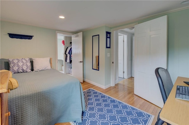 426 Buxton St, North Smithfield, RI 02896 - bedroom featuring wood finished floors, ornamental molding, recessed lighting, an office area, and a walk in closet