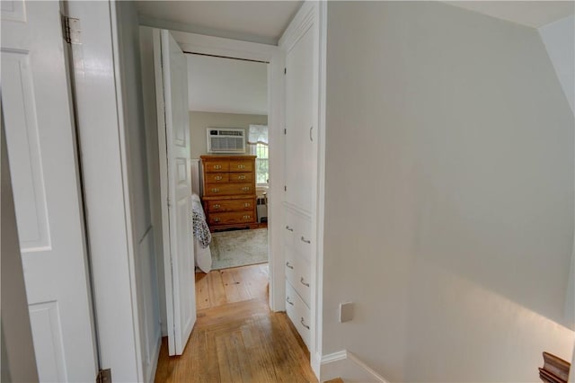 426 Buxton St, North Smithfield, RI 02896 - corridor with light wood-type flooring and a wall mounted air conditioner