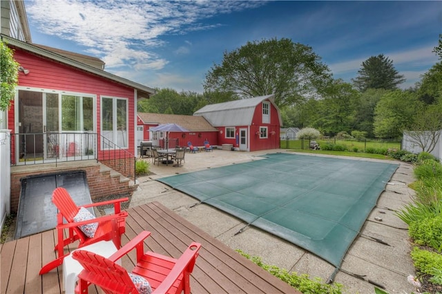 426 Buxton St, North Smithfield, RI 02896 - view of pool featuring an outbuilding, a wooden deck, a patio area, and outdoor dining area
