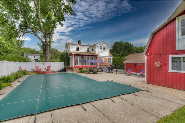 426 Buxton St, North Smithfield, RI 02896 - view of swimming pool with a sunroom and a patio area