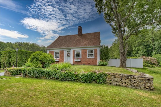 426 Buxton St, North Smithfield, RI 02896 - cape cod home with a chimney and brick siding