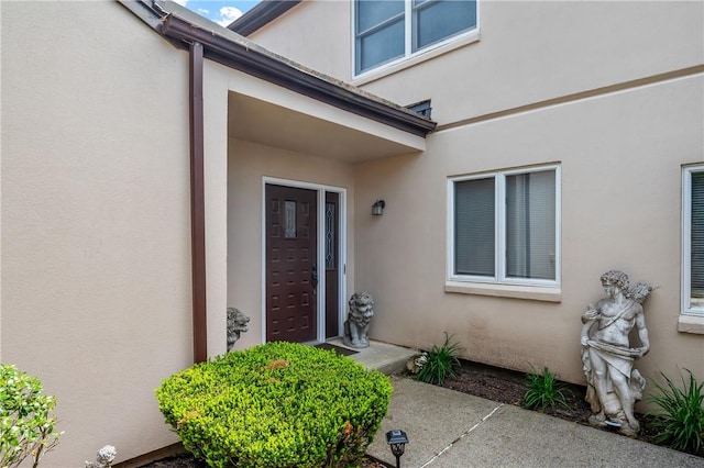 2970 Mendon Rd Unit 154, Cumberland, RI 02864 - view of exterior entry featuring stucco siding