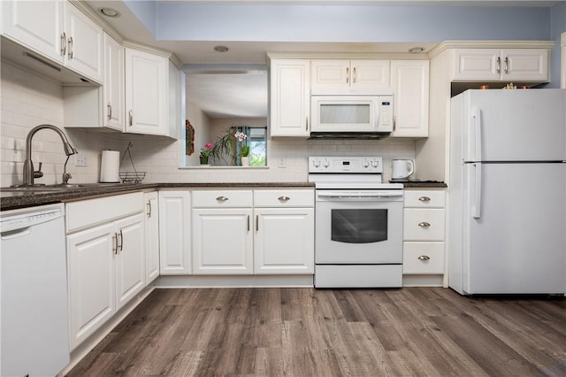 2970 Mendon Rd Unit 154, Cumberland, RI 02864 - kitchen featuring white appliances, dark wood-style flooring, decorative backsplash, white cabinetry, and dark countertops