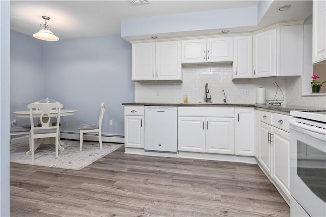 2970 Mendon Rd Unit 154, Cumberland, RI 02864 - kitchen featuring white appliances, a baseboard heating unit, tasteful backsplash, and dark countertops