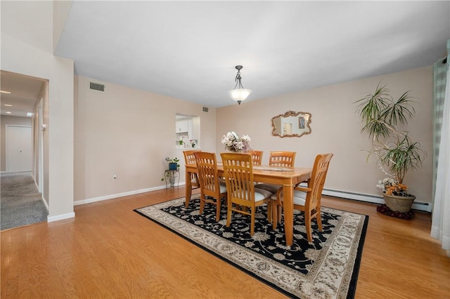 2970 Mendon Rd Unit 154, Cumberland, RI 02864 - dining room featuring light wood-style floors, stairs, and a baseboard heating unit