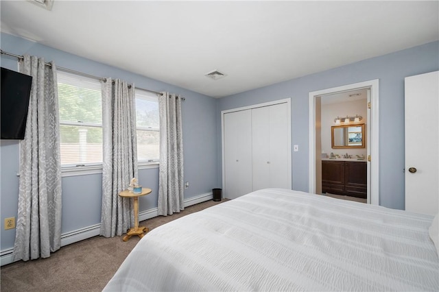 2970 Mendon Rd Unit 154, Cumberland, RI 02864 - carpeted bedroom with ensuite bath, a closet, and a baseboard heating unit