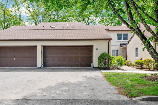 2970 Mendon Rd Unit 154, Cumberland, RI 02864 - view of front facade featuring stucco siding, asphalt driveway, and a shingled roof