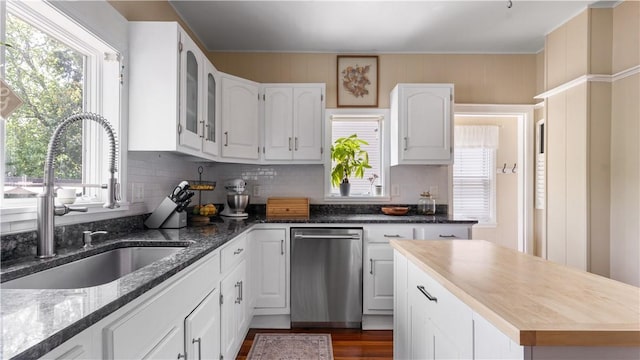 280 Woodbine St, Cranston, RI 02910 - kitchen featuring dishwasher, white cabinets, tasteful backsplash, plenty of natural light, and ornamental molding