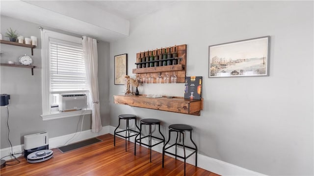 280 Woodbine St, Cranston, RI 02910 - kitchen featuring open shelves, cooling unit, wood finished floors, and a breakfast bar