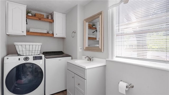 280 Woodbine St, Cranston, RI 02910 - washroom featuring washer and clothes dryer and cabinet space