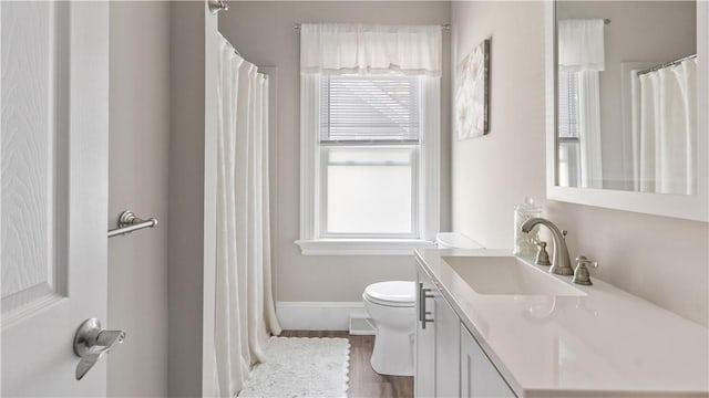 280 Woodbine St, Cranston, RI 02910 - full bathroom with plenty of natural light, vanity, wood finished floors, and curtained shower