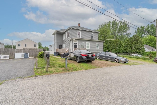 12 Lenox St, Cumberland, RI 02864 - american foursquare style home featuring a chimney