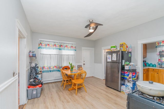 12 Lenox St, Cumberland, RI 02864 - dining room with light wood-style flooring, a ceiling fan, and baseboard heating