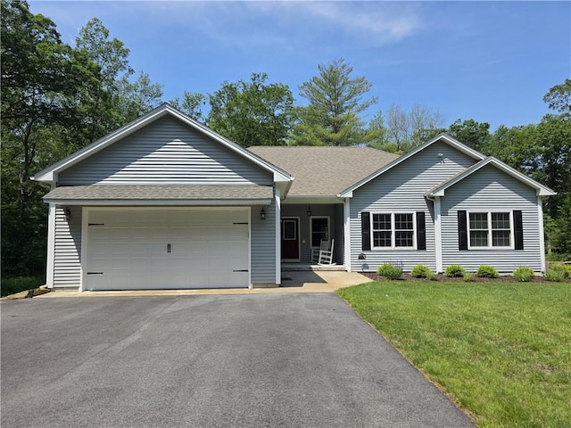 475 Danielson Pike, Scituate, RI 02857 - single story home with an attached garage, asphalt driveway, a front yard, and roof with shingles