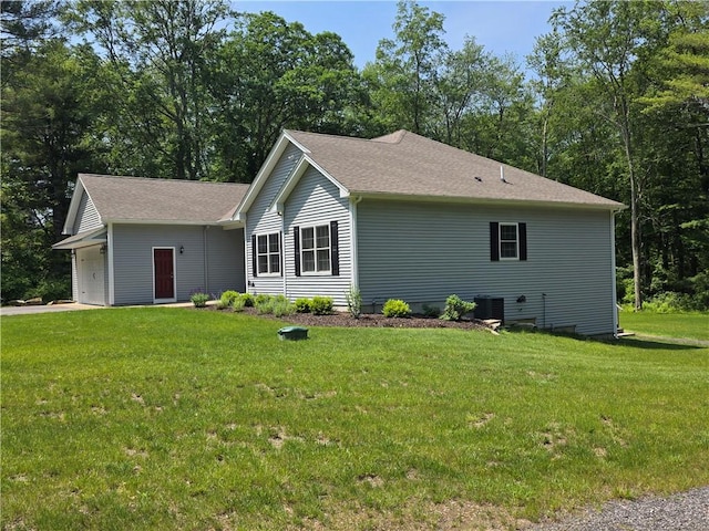 475 Danielson Pike, Scituate, RI 02857 - view of side of home featuring a lawn, a garage, and roof with shingles