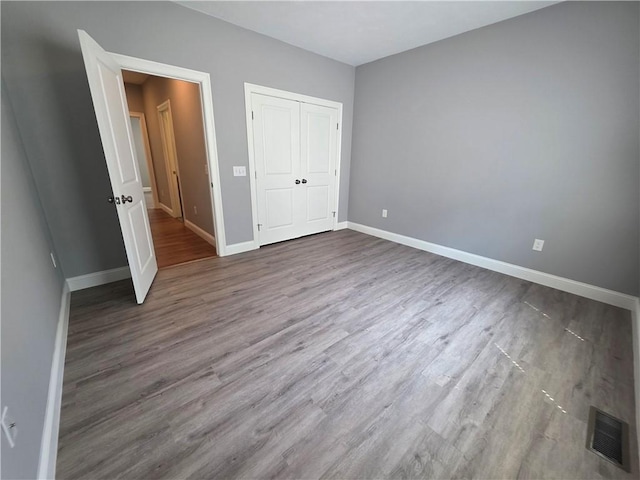 475 Danielson Pike, Scituate, RI 02857 - unfurnished bedroom with wood finished floors and a closet