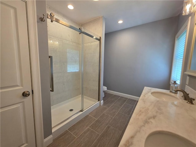 475 Danielson Pike, Scituate, RI 02857 - bathroom with double vanity, a stall shower, and recessed lighting