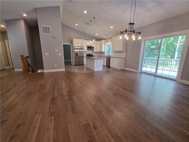 475 Danielson Pike, Scituate, RI 02857 - unfurnished living room featuring a chandelier, dark wood-style floors, recessed lighting, and high vaulted ceiling