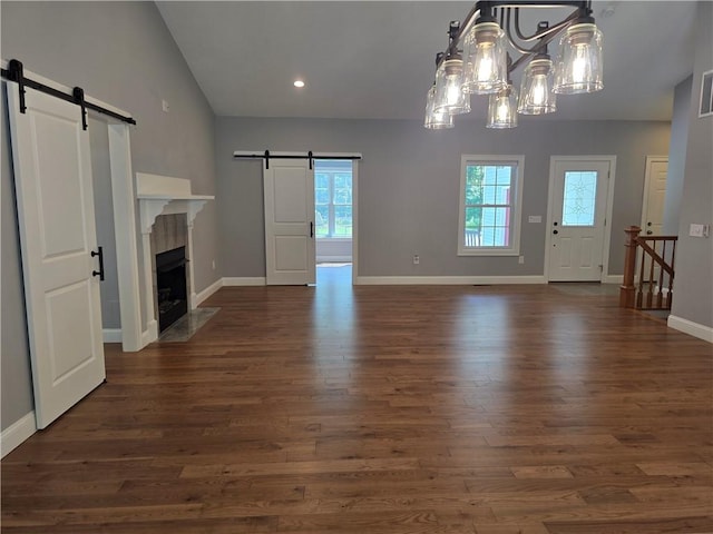 475 Danielson Pike, Scituate, RI 02857 - unfurnished living room featuring a barn door, plenty of natural light, dark wood finished floors, a chandelier, and recessed lighting