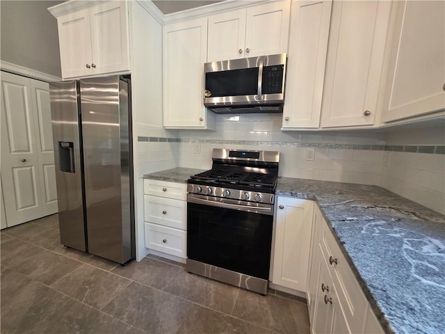 475 Danielson Pike, Scituate, RI 02857 - kitchen with stainless steel appliances, white cabinetry, dark stone countertops, and backsplash