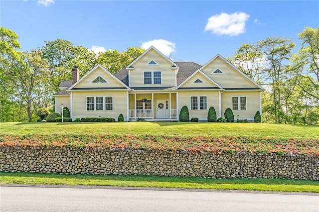 3 Piezzo Dr, Westerly, RI 02891 - traditional-style home featuring a porch, a front yard, and a chimney