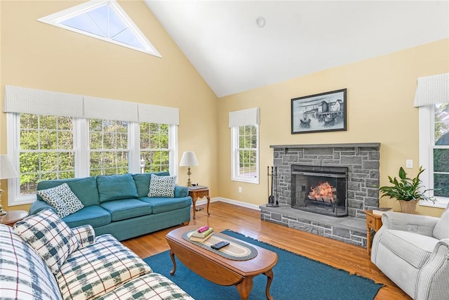 3 Piezzo Dr, Westerly, RI 02891 - living area featuring high vaulted ceiling, wood finished floors, plenty of natural light, and a stone fireplace