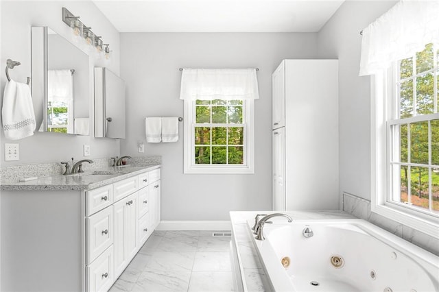 3 Piezzo Dr, Westerly, RI 02891 - full bathroom with plenty of natural light, double vanity, marble finish flooring, and a tub with jets