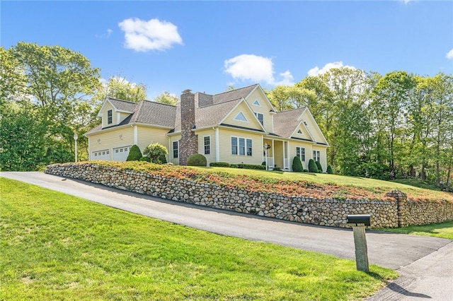 3 Piezzo Dr, Westerly, RI 02891 - view of front facade featuring a chimney, an attached garage, and a front lawn