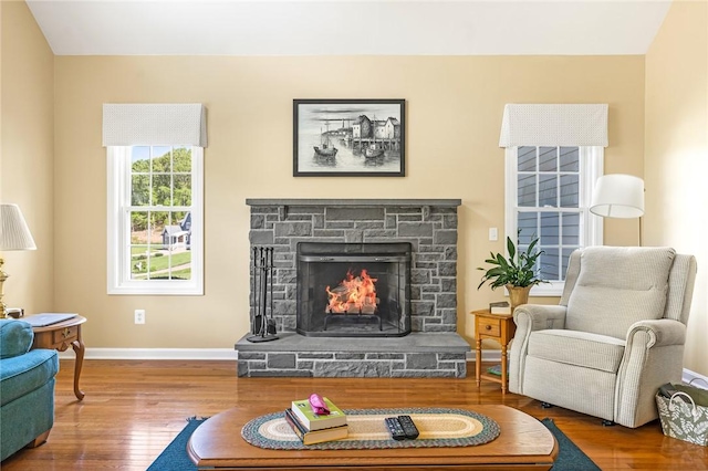 3 Piezzo Dr, Westerly, RI 02891 - living room featuring wood finished floors and a stone fireplace