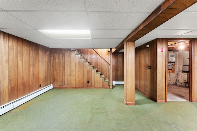 15 Rutland St, Warwick, RI 02888 - finished basement with carpet floors, baseboard heating, a paneled ceiling, stairway, and wood walls