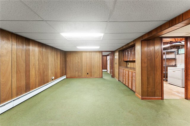 15 Rutland St, Warwick, RI 02888 - finished basement featuring washer / dryer, a baseboard heating unit, light colored carpet, wooden walls, and a drop ceiling